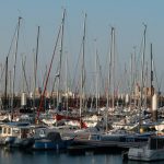 A serene view of sailboats docked at Le Havre Marina in Normandy, France. Une vue sereine de voiliers amarrés à la Marina du Havre en Normandie, France.